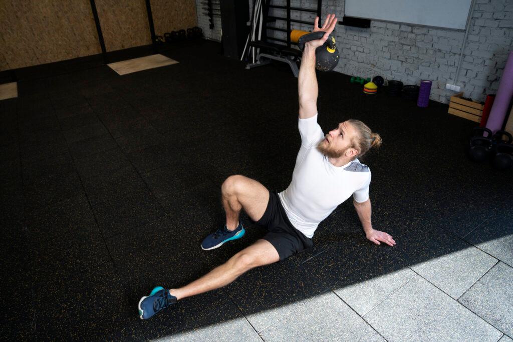 person-sport-gym-using-kettlebells