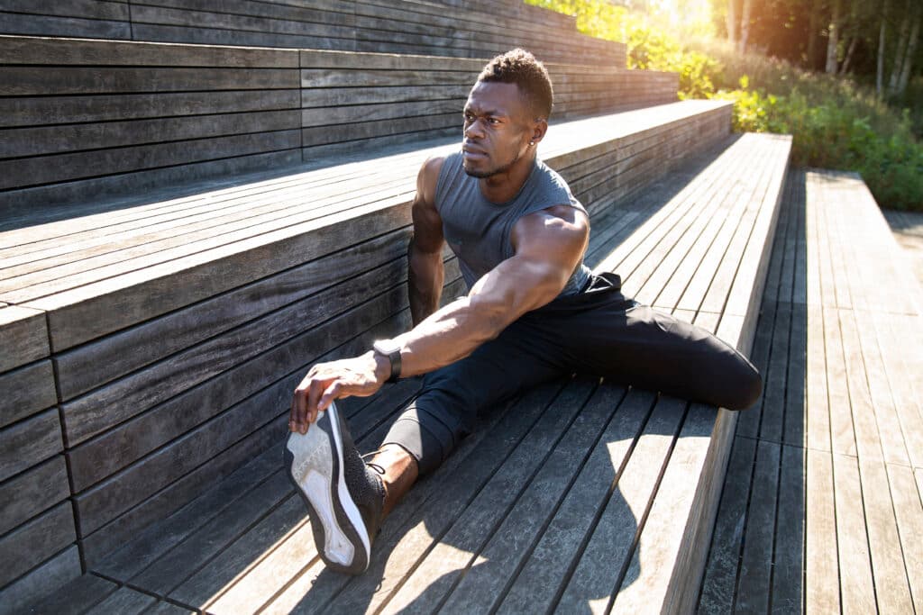 full-shot-man-stretching-outside