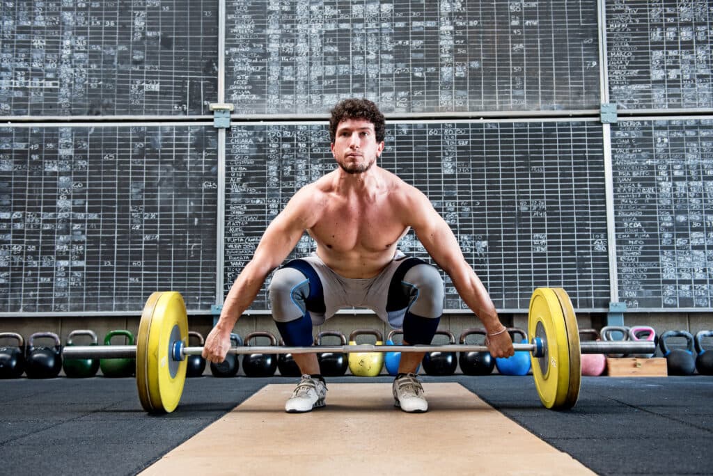 Bodybuilder preparing to lift barbell