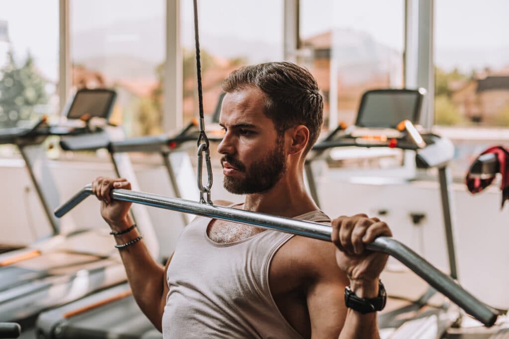 portrait-young-man-lifting-weights
