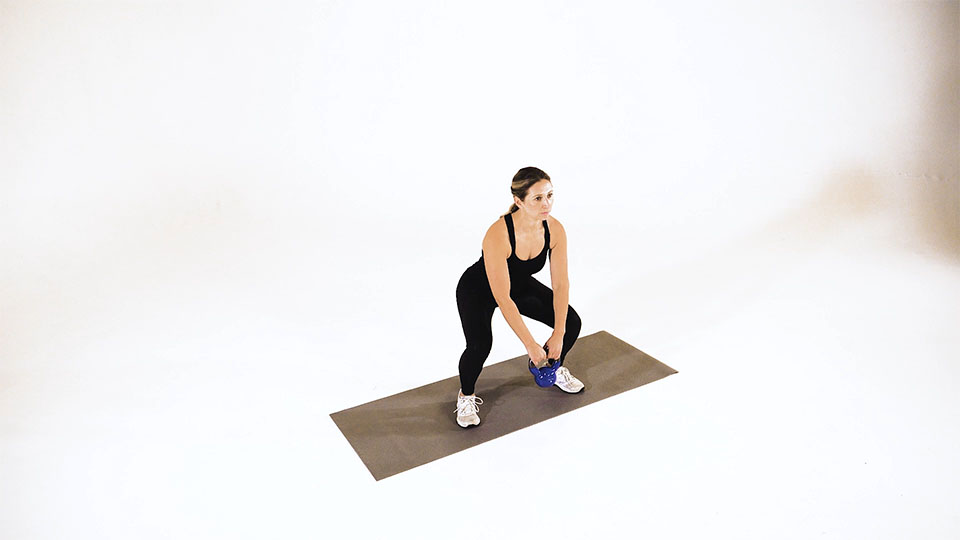 Kettlebell Leg Pass exercise