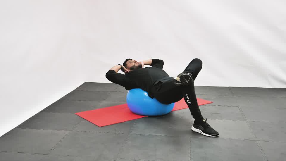 Stability Ball Cross-Leg Crunch exercise