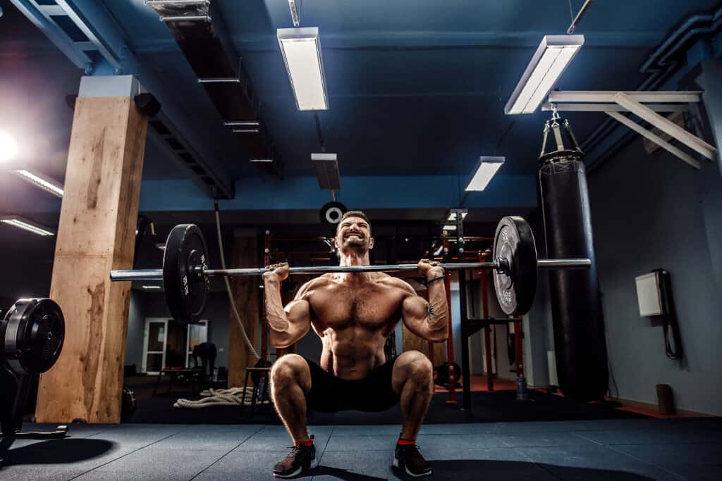 man lifting barbell