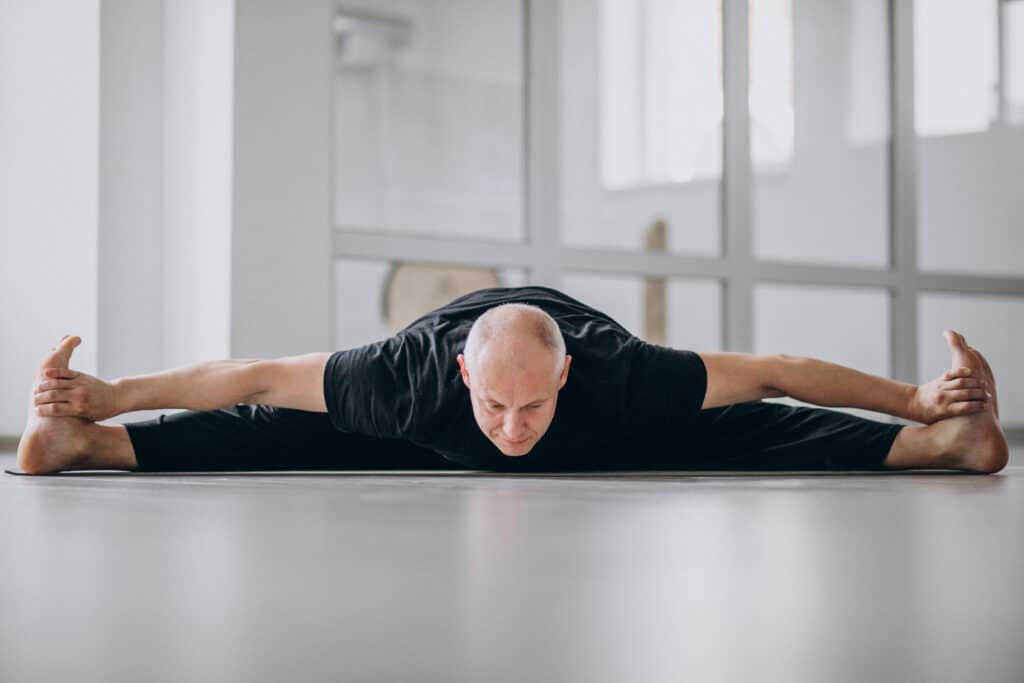 man practicing yoga