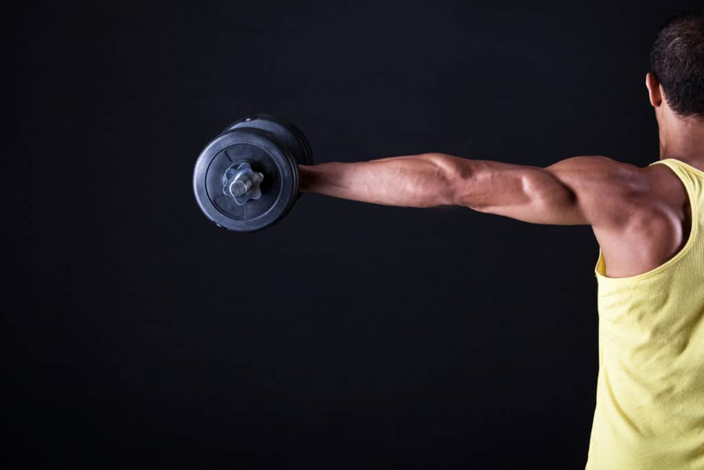 man doing dumbbell lateral raise