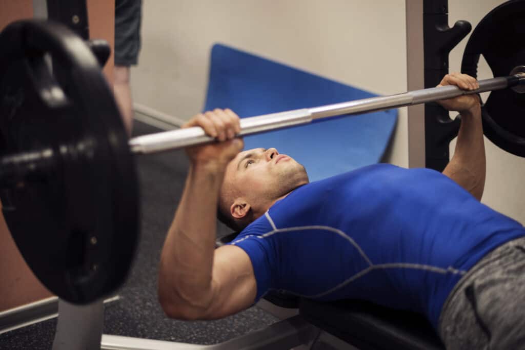man doing bench press