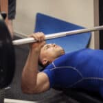 man doing bench press