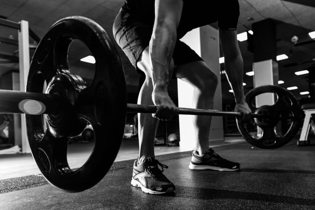 man doing barbell deadlift