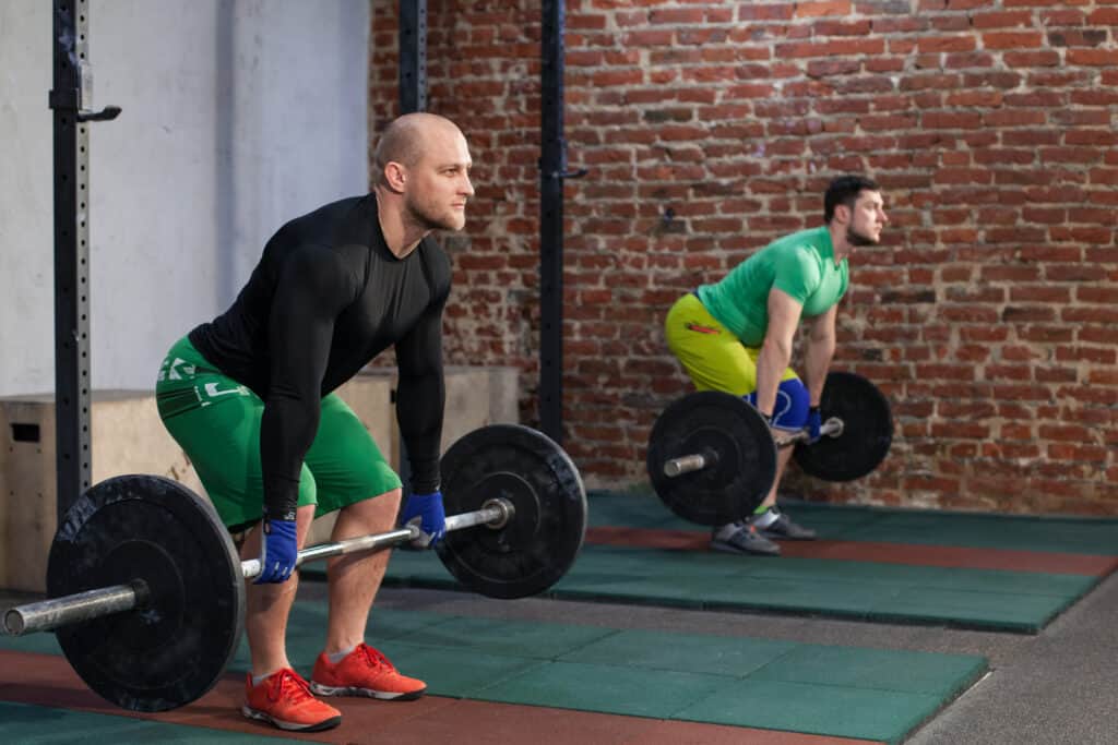 two men doing a deadlift