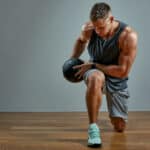 man exercising with medicine ball