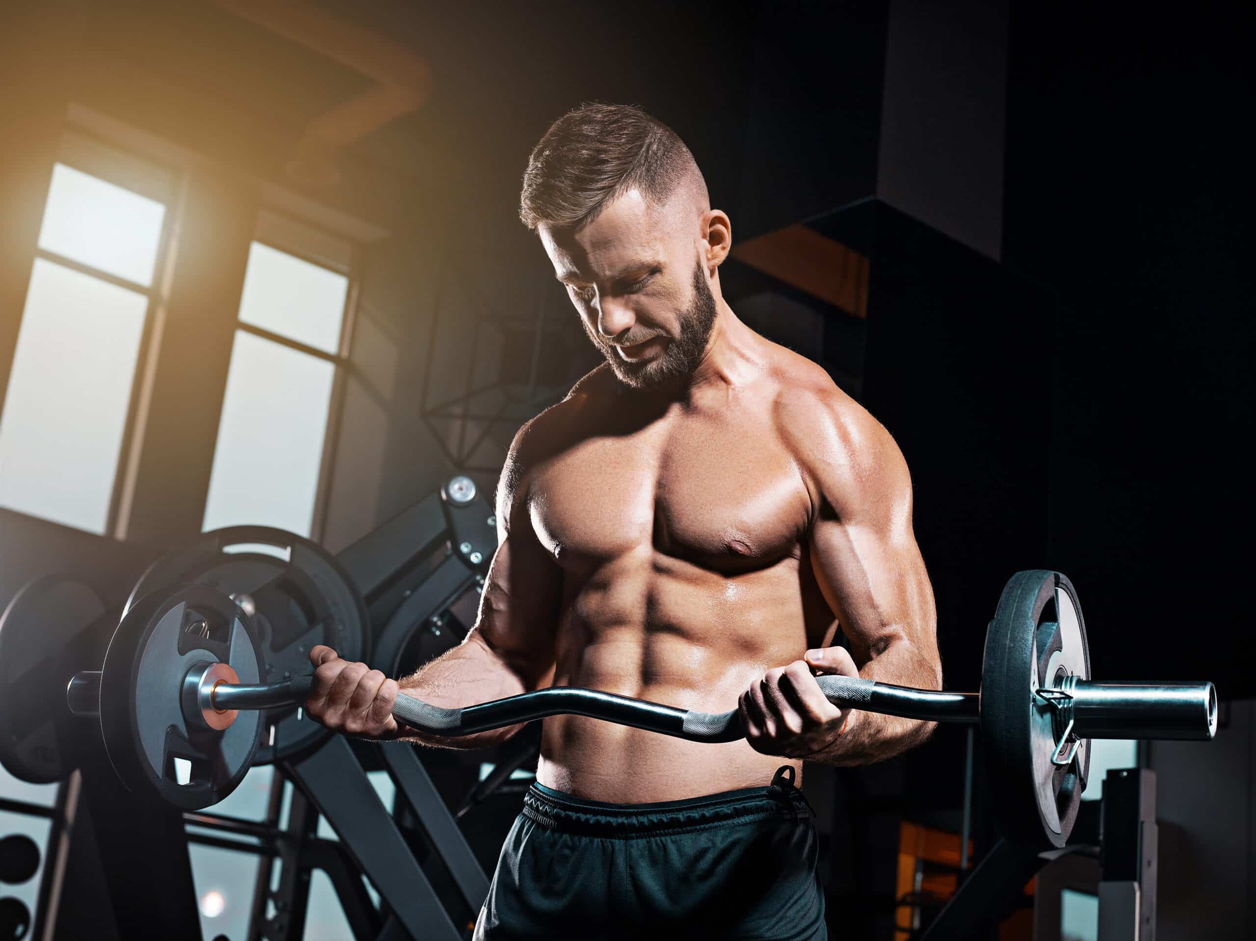 man doing bicep curls with ez-bar