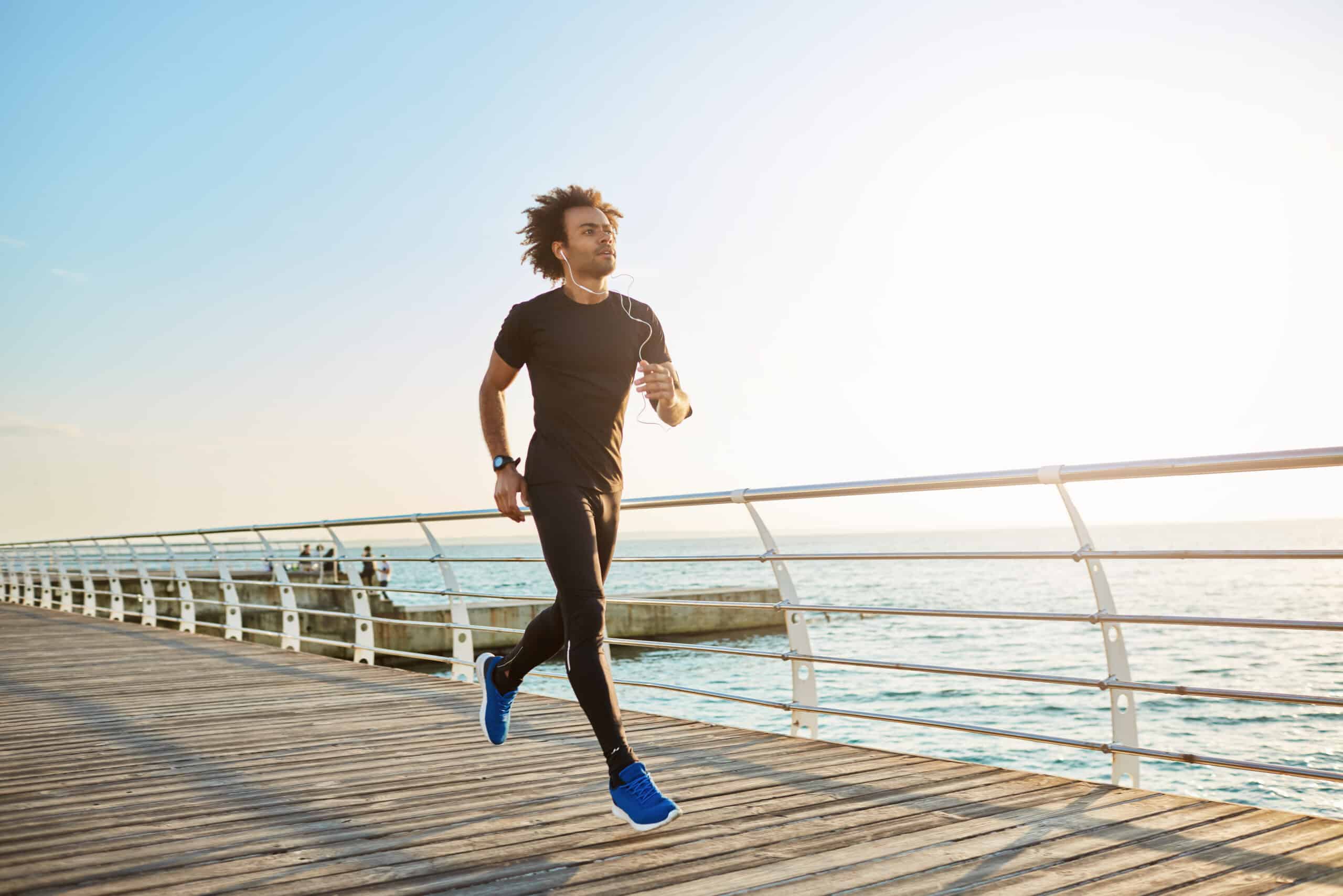 man jogging on pier