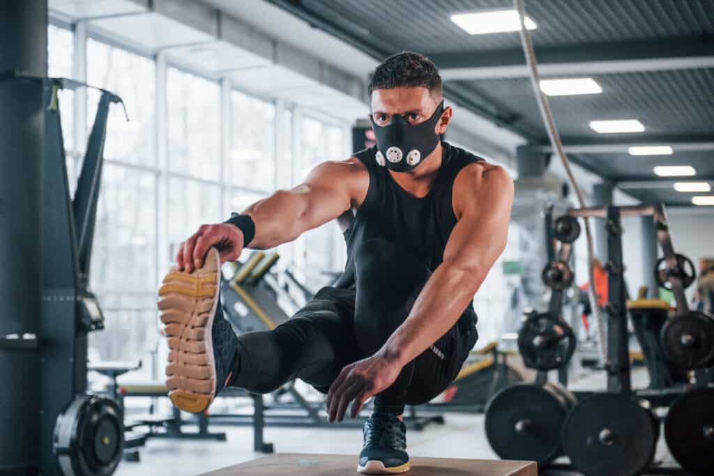 man wearing max working out at the gym