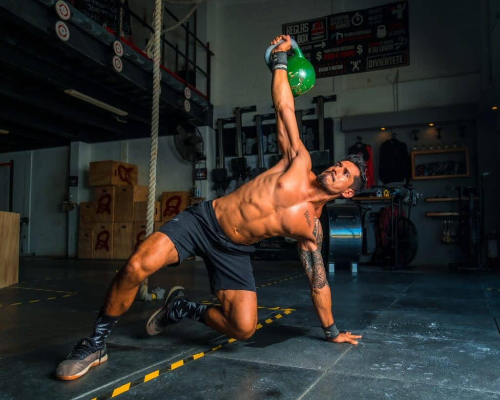 man working out with kettlebell