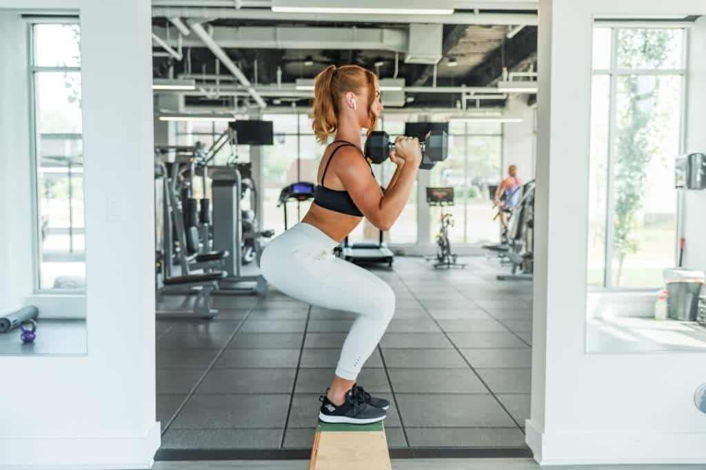 woman working out with dumbbells