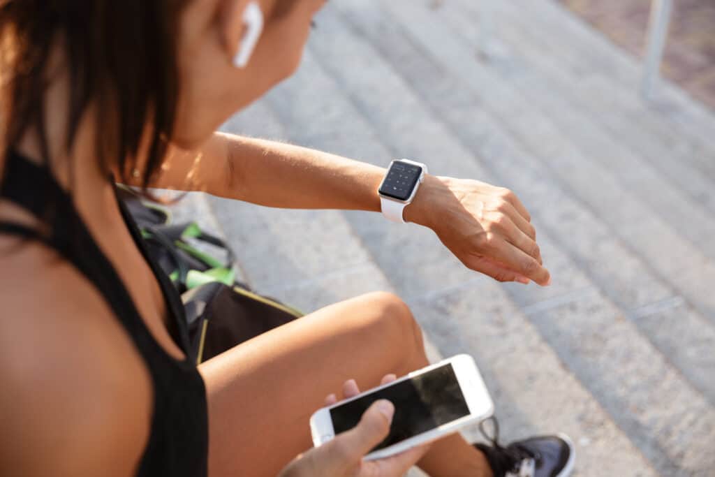 woman looking at smart watch