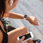 woman looking at smart watch