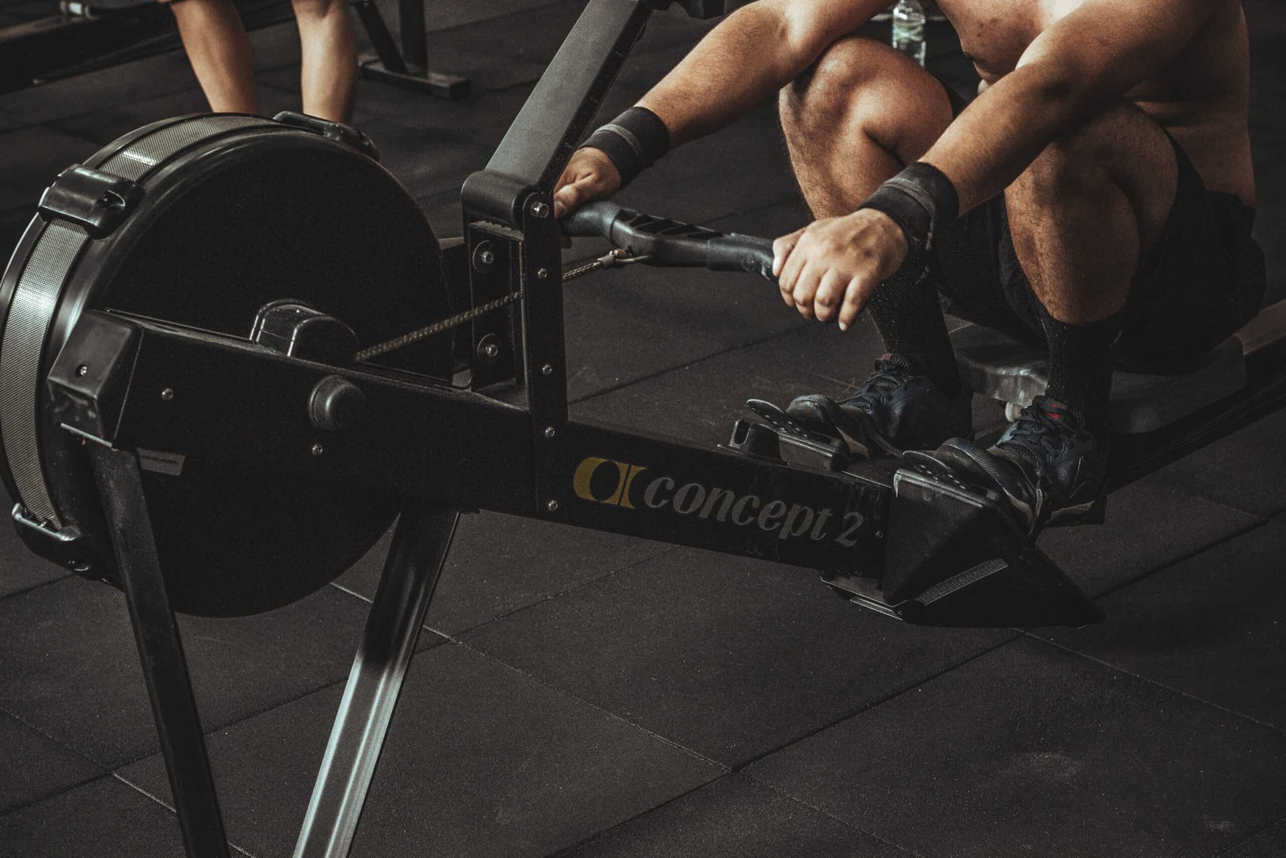 man working out on rowing machine