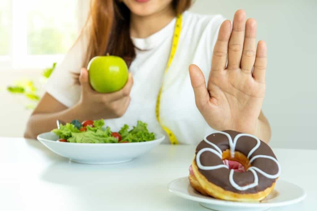 woman trying to avoid sugar filled treats