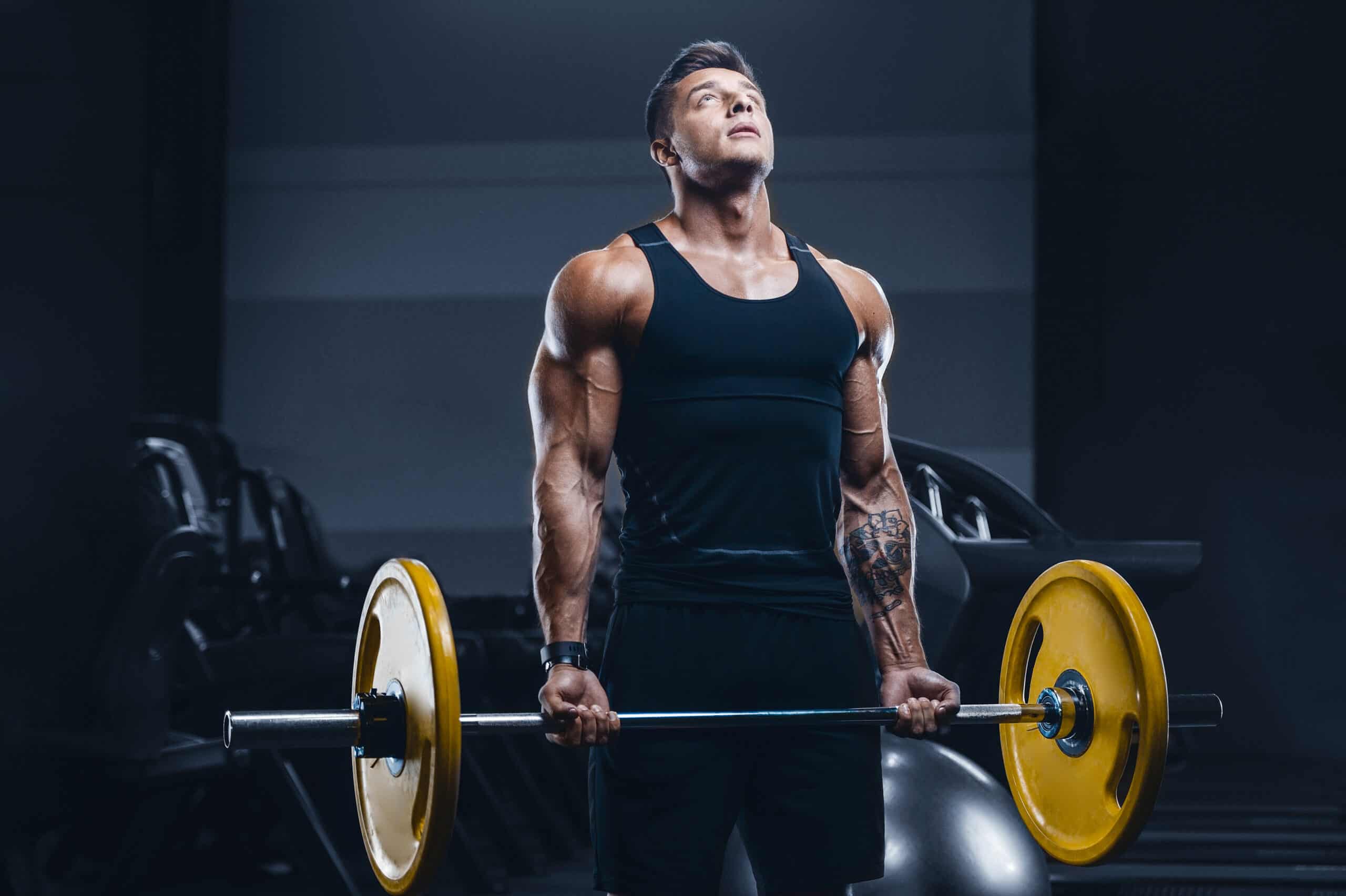 man doing barbell bicep curls