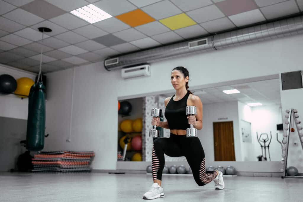 woman working out with dumbbells