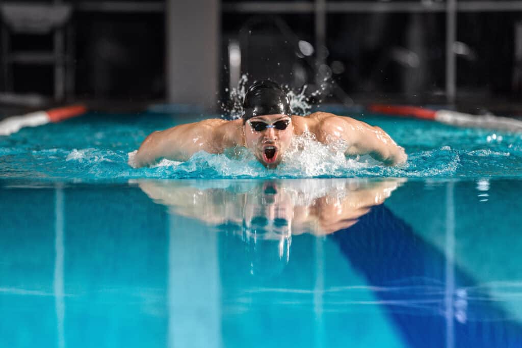 man doing butterfly stroke