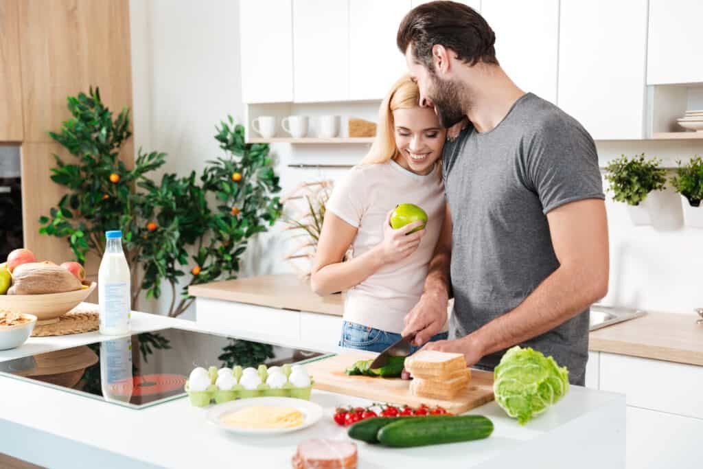 young couple prepping healthy food