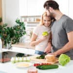 young couple prepping healthy food