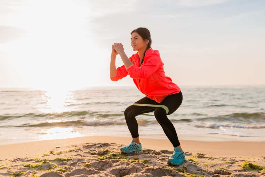 woman working out at the beach