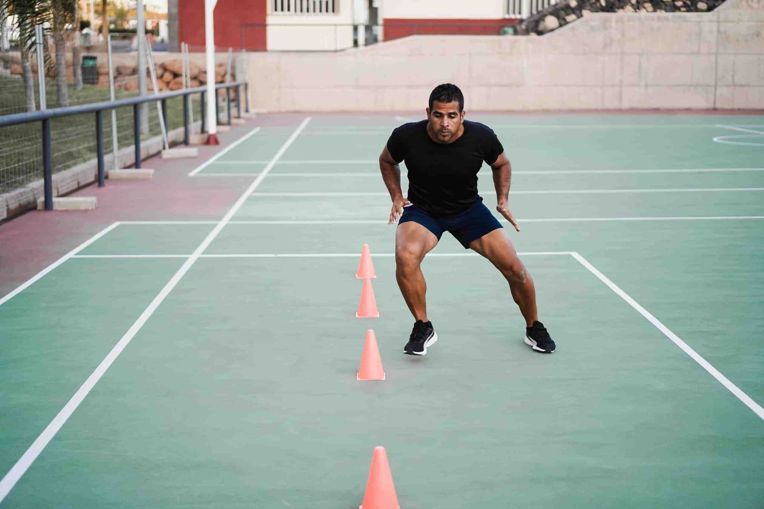 man doing agility cone drills