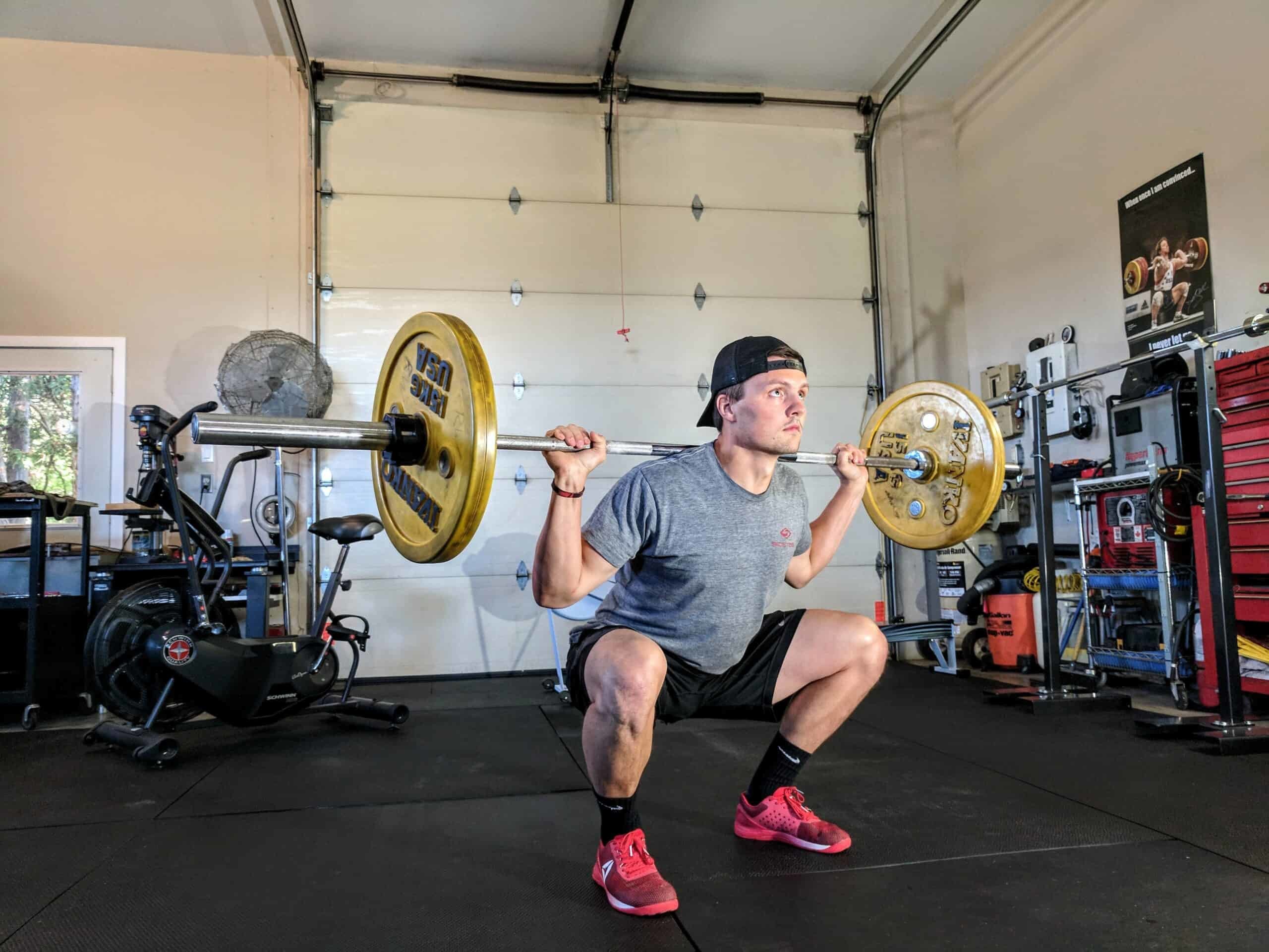 man working out in garage gym