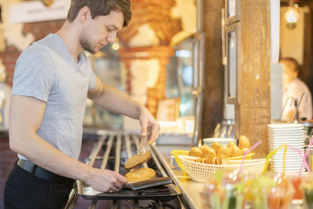 man picking breakfast ingredients