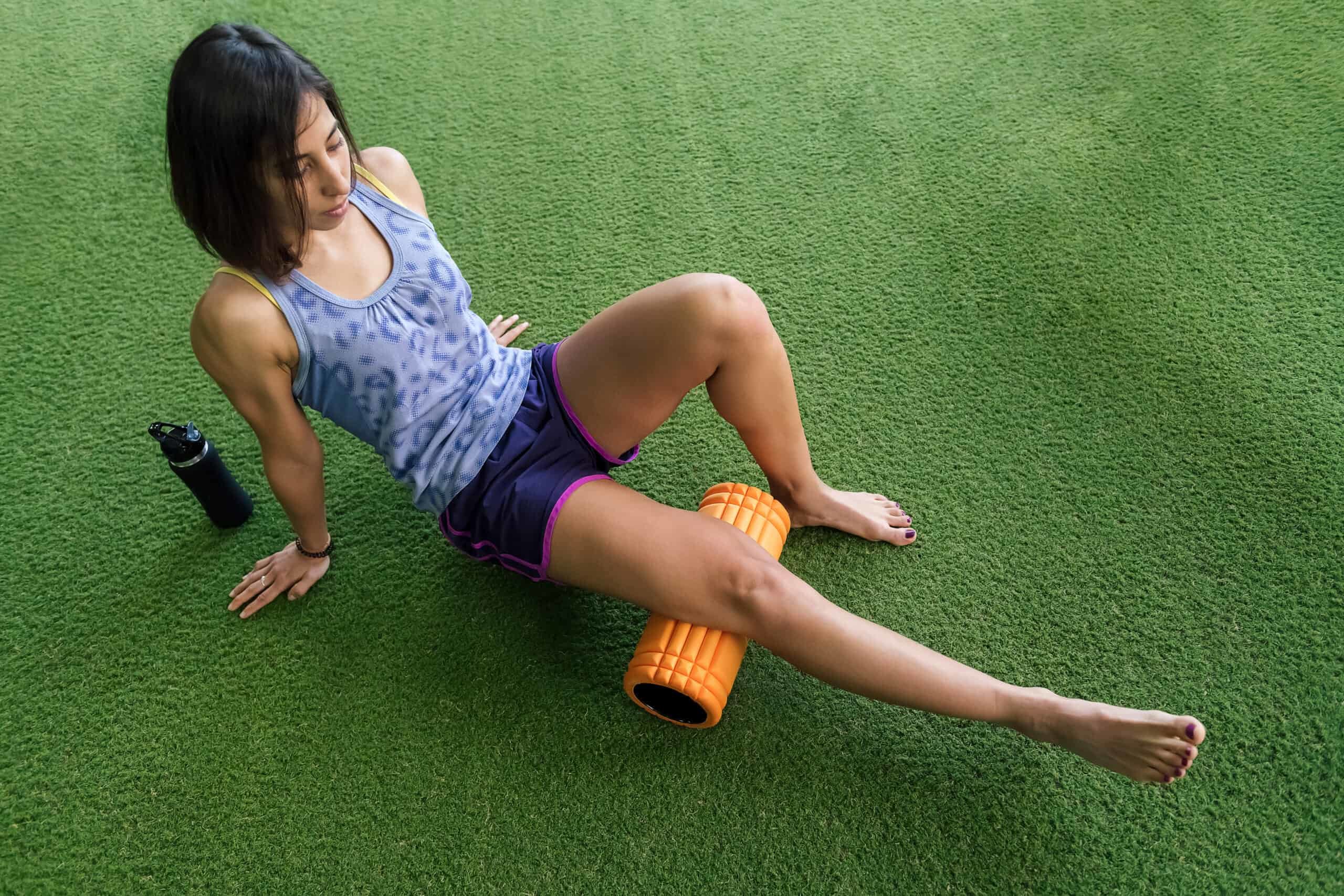 woman using foam roller to help with muscle fatigue