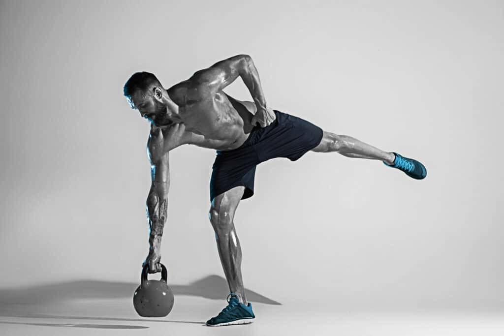 man working out with kettlebell