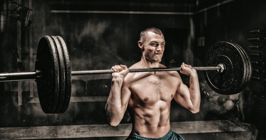 man lifting barbell