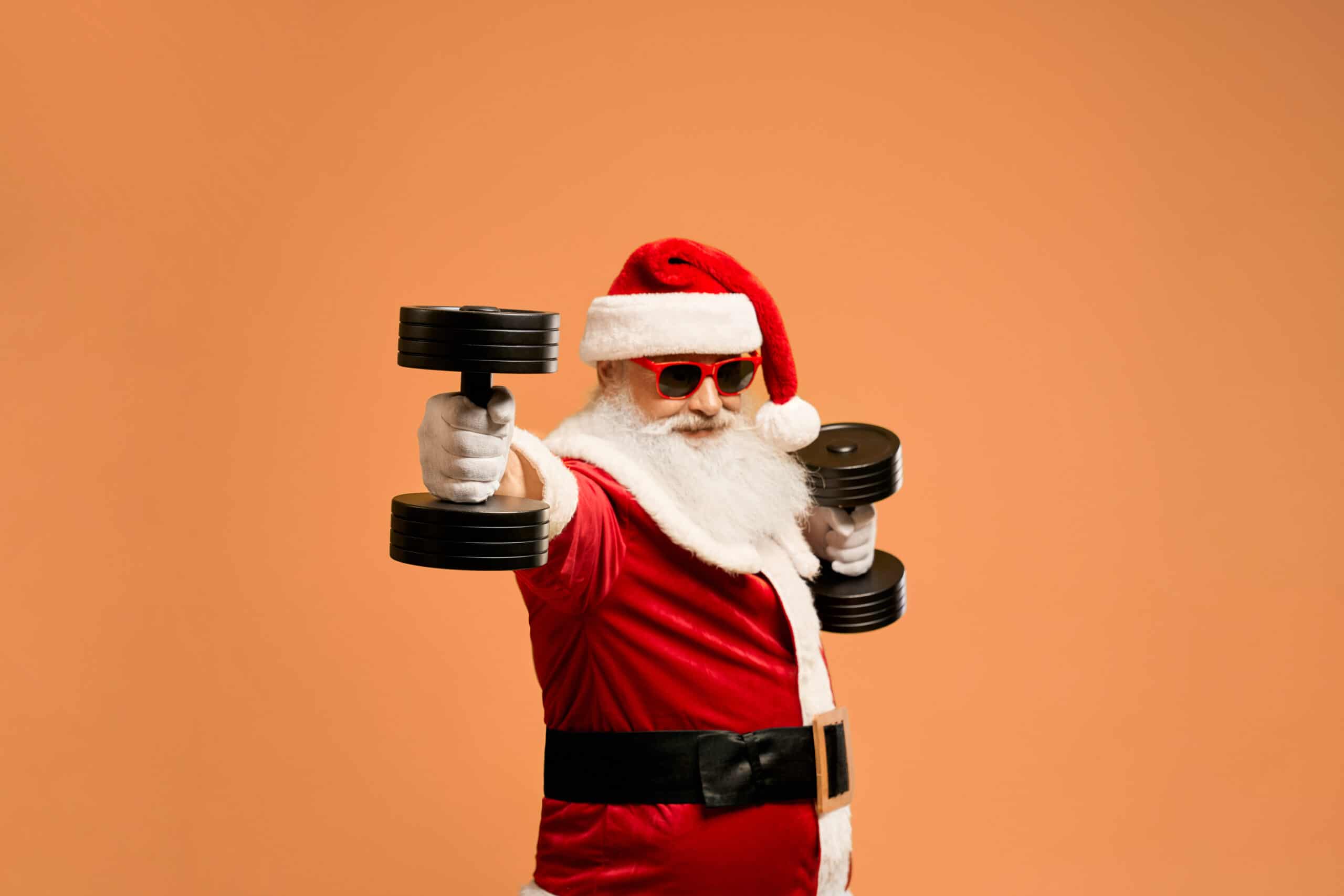 Santa working out with dumbbells
