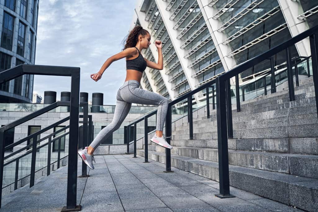 woman running up stairs