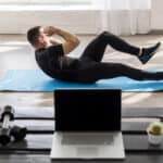 man doing ab workout on yoga mat