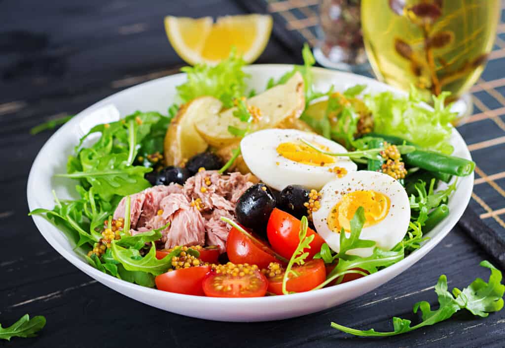 Salad with tuna, eggs, and tomatoes