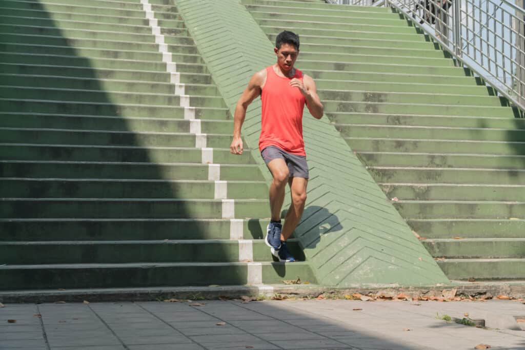 man running down steps