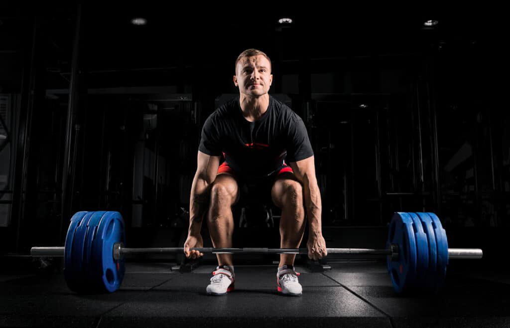 man doing barbell deadlift