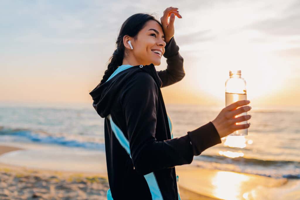 woman on beach resting from exercise