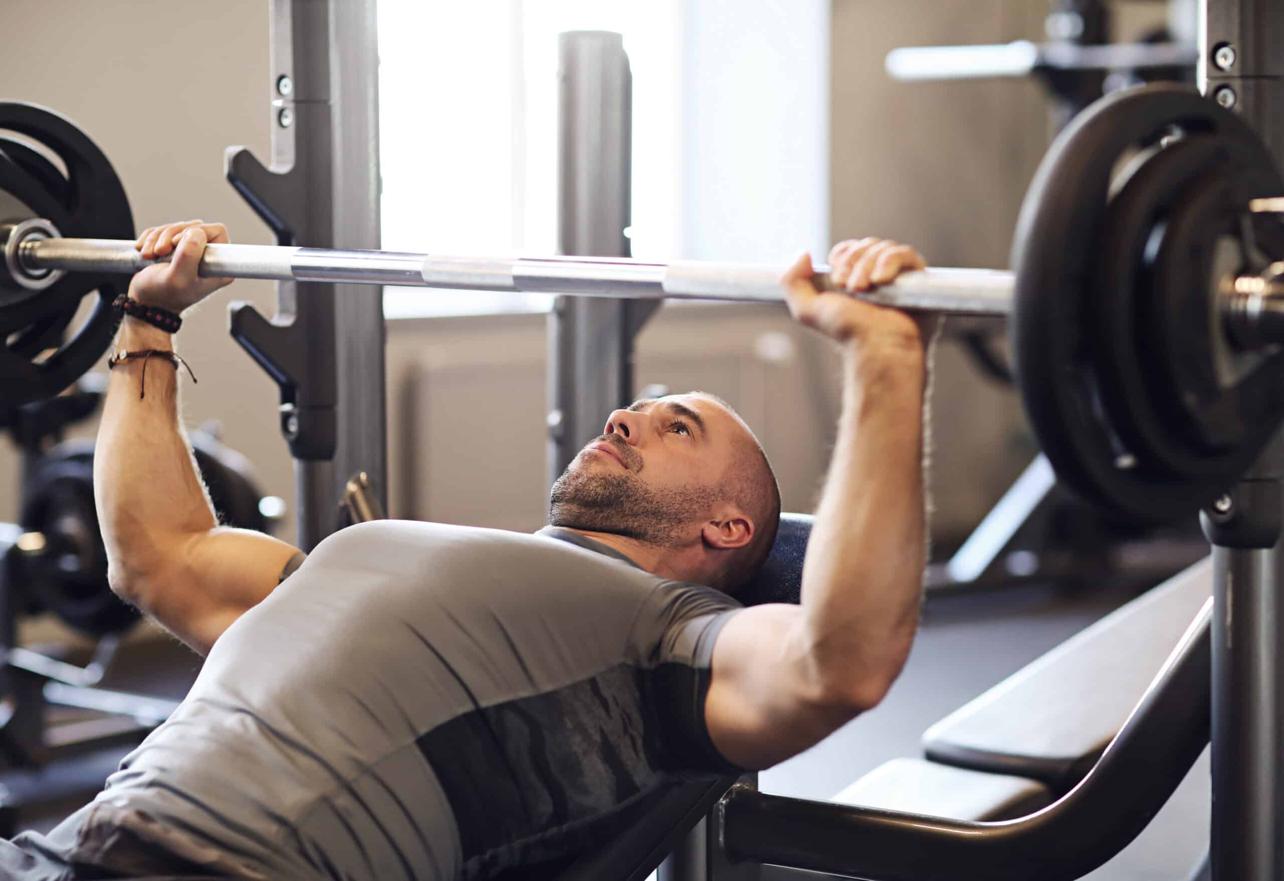 man preparing to bench press