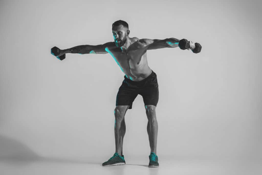 man performing dumbbell fly