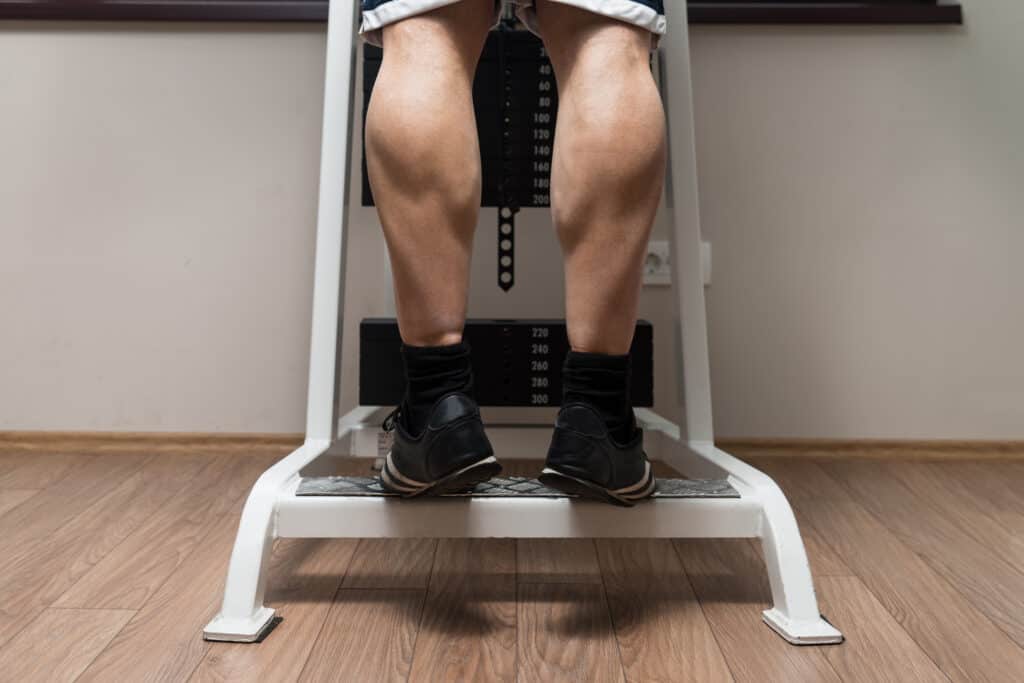 man doing heavy weight leg exercises