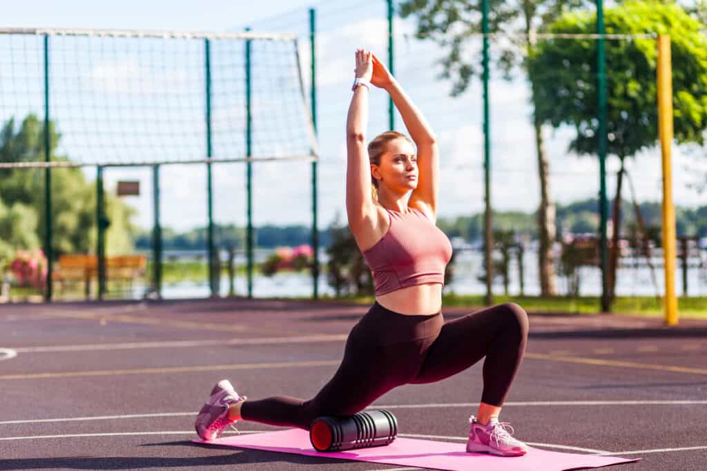 woman stretching at park