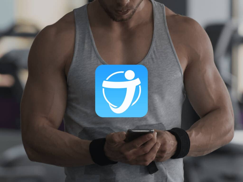 man using phone at gym