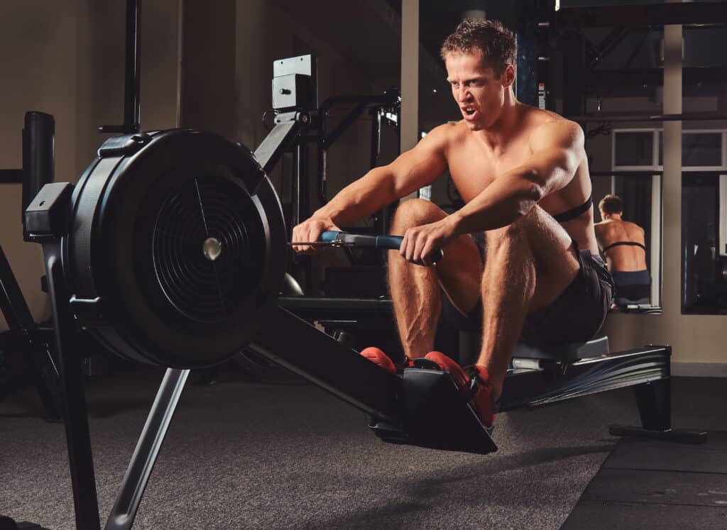 man using a rowing machine