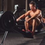 man using rowing machine