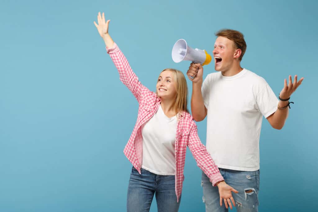 young couple sharing their news with the world